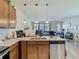 Open-concept kitchen featuring stainless steel appliances and granite countertops at 14432 Orchid Island Dr, Orlando, FL 32827