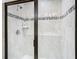 Contemporary shower with glass enclosure, modern fixtures, and tiled walls at 14432 Orchid Island Dr, Orlando, FL 32827