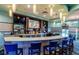Community clubhouse bar with multiple televisions and plenty of seating at 1584 Plunker Dr, Davenport, FL 33896