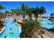 Resort style amenities include a lazy river and pools surrounded by tropical landscaping at 1584 Plunker Dr, Davenport, FL 33896