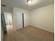 Bedroom featuring carpeted floor, closet with double doors and access to the hallway at 15872 Moonlight Bay St, Winter Garden, FL 34787