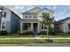 Charming two-story home with a well-manicured lawn and inviting front porch at 15872 Moonlight Bay St, Winter Garden, FL 34787