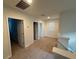 Upstairs hallway featuring carpeted floor, doors and stairway with white banister at 15872 Moonlight Bay St, Winter Garden, FL 34787