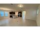 Expansive living space with open floor plan, featuring a kitchen and tile flooring at 15872 Moonlight Bay St, Winter Garden, FL 34787