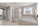 The bathroom features a shower, tub, and large tiles at 1628 Thetford Cir, Orlando, FL 32824