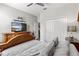 Relaxing bedroom with a TV and soft lighting creates a comfortable and inviting space at 1628 Thetford Cir, Orlando, FL 32824