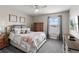 Bright bedroom with a serene view, soft carpet, and comfortable furnishings that create a peaceful retreat at 1628 Thetford Cir, Orlando, FL 32824