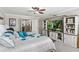 Beautiful bedroom offering a TV, ceiling fan, queen size bed, and lots of natural light at 1628 Thetford Cir, Orlando, FL 32824
