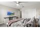 Inviting bedroom with TV, ample storage, and cozy bedding for a comfortable and relaxing atmosphere at 1628 Thetford Cir, Orlando, FL 32824