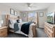 Comfortable bedroom with neutral colors, window views, and wooden furniture set at 1628 Thetford Cir, Orlando, FL 32824