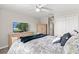 Bright bedroom features a television, soft carpet, and neutral color tones at 1628 Thetford Cir, Orlando, FL 32824
