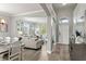 Inviting foyer showcases an open layout, hardwood floors, and seamless transitions to the living and dining areas at 1628 Thetford Cir, Orlando, FL 32824