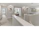 Bright hallway leading to bedrooms with modern design and neutral color palette creates a welcoming space at 1628 Thetford Cir, Orlando, FL 32824