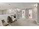 Comfortable living area with neutral tones and access to various rooms creates an inviting and functional space at 1628 Thetford Cir, Orlando, FL 32824