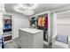 Well-organized walk-in closet featuring custom shelving, drawers, and elegant lighting, perfect for storage at 1628 Thetford Cir, Orlando, FL 32824