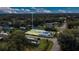 An aerial view of a charming home with a well-maintained yard and surrounding lush greenery at 18302 15Th Ave, Orlando, FL 32833