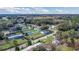 Expansive aerial shot capturing the home's location within a quiet, wooded neighborhood at 18302 15Th Ave, Orlando, FL 32833