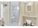 This bathroom contains a glass enclosed shower, a built-in vanity, and tile flooring at 18302 15Th Ave, Orlando, FL 32833