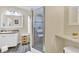 Modern bathroom featuring a vanity, shower with glass door, and neutral decor for a clean aesthetic at 18302 15Th Ave, Orlando, FL 32833