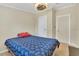 Clean bedroom with a bed, neutral walls, wood flooring, and access to doorways to different areas at 18302 15Th Ave, Orlando, FL 32833