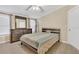 Comfortable bedroom featuring a wood frame bed, wood-look flooring, and a dresser with mirror at 18302 15Th Ave, Orlando, FL 32833