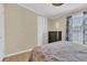 Comfortable bedroom with wood floors, dresser, and a view of the natural light from the window at 18302 15Th Ave, Orlando, FL 32833
