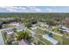Aerial view of a quiet residential neighborhood with tree lined streets, and homes with green lawns at 18302 15Th Ave, Orlando, FL 32833
