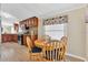 Open dining area with a round table, window, and seamless flow to the adjacent kitchen at 18302 15Th Ave, Orlando, FL 32833