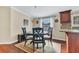 Cozy dining area with dark wood table set, bright window, and stylish decor at 18302 15Th Ave, Orlando, FL 32833