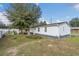 Charming home featuring vinyl siding, well-maintained landscaping, and an expansive lawn at 18302 15Th Ave, Orlando, FL 32833