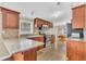 Cozy kitchen featuring granite countertops, mosaic backsplash, ample wood cabinetry, and breakfast nook at 18302 15Th Ave, Orlando, FL 32833