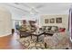 Open-concept living area with hardwood floors, comfortable seating, and seamless flow to the kitchen at 18302 15Th Ave, Orlando, FL 32833