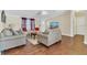 Inviting living room with hardwood floors, neutral walls, and comfortable seating arrangement at 18302 15Th Ave, Orlando, FL 32833