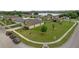 Aerial view of a house in a residential neighborhood with a well-manicured lawn at 1924 Piedmont Ct, Mascotte, FL 34753