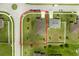 Aerial view of a house with a large yard and driveway at 1924 Piedmont Ct, Mascotte, FL 34753