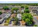 An aerial view showcasing the neighborhood with mature trees close to nearby highway and recreational area at 205 Twisting Trl, Orlando, FL 32825