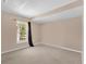 Cozy bedroom with beige carpet, and a window letting in natural light at 205 Twisting Trl, Orlando, FL 32825
