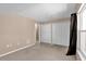 Bedroom featuring neutral carpet, ample closet space, and a window for natural light at 205 Twisting Trl, Orlando, FL 32825
