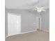 Bright, airy bedroom with ceiling fan and closet, leading to an open doorway at 205 Twisting Trl, Orlando, FL 32825
