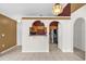 Bright kitchen with wooden cabinets, and an open serving bar that connects the kitchen to the dining area at 205 Twisting Trl, Orlando, FL 32825