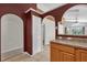 View of the kitchen area from the dining area, with modern appliances and a breakfast bar at 205 Twisting Trl, Orlando, FL 32825