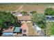 Aerial view of the property showcasing a backyard with patio, shed, and ample green space at 2342 Linda St, Lake Wales, FL 33898