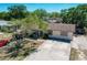 Overhead view of a charming home featuring a well-maintained driveway and mature trees at 2342 Linda St, Lake Wales, FL 33898