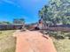Spacious backyard features a patio area with outdoor kitchen, basketball hoop and storage shed at 2342 Linda St, Lake Wales, FL 33898