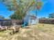 Charming backyard featuring a storage shed and a cozy firepit area for outdoor relaxation and enjoyment at 2342 Linda St, Lake Wales, FL 33898