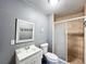 Updated bathroom with a tiled shower stall, vanity with modern faucet, and ceramic tile floors at 2342 Linda St, Lake Wales, FL 33898