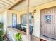 Welcoming front porch with stone accents, seating area, and a stylish front door at 2342 Linda St, Lake Wales, FL 33898