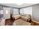 Cozy living room with hardwood floors, two sofas, and great natural light from the window at 2342 Linda St, Lake Wales, FL 33898