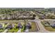 Aerial shot highlighting property lines and surrounding neighborhood, showcasing the home's location at 2451 Spring Breeze Dr, Leesburg, FL 34748
