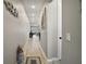 Bright hallway with wood-look floors leading to the living area at 2451 Spring Breeze Dr, Leesburg, FL 34748